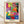 Abstract cut-out style framed poster of a dynamic Creole dancer in vibrant red, blue, and ochre tones with bold black outlines, capturing rhythmic movement and joyful energy.