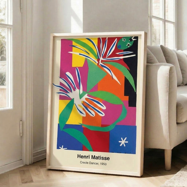 Framed modern abstract print of a Creole dancer with fluid, expressive forms in vivid reds and blues accented by warm ochre, creating a sense of rhythmic celebration.