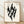 Abstract Japanese woodblock silhouette of a cypress tree rendered as flickering flame in black and cream, creating a contemplative, minimalist composition.