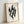 Minimalist Japanese-inspired silhouette art depicting a cypress as an ethereal flame shape in black and cream tones, evoking quiet contemplation.