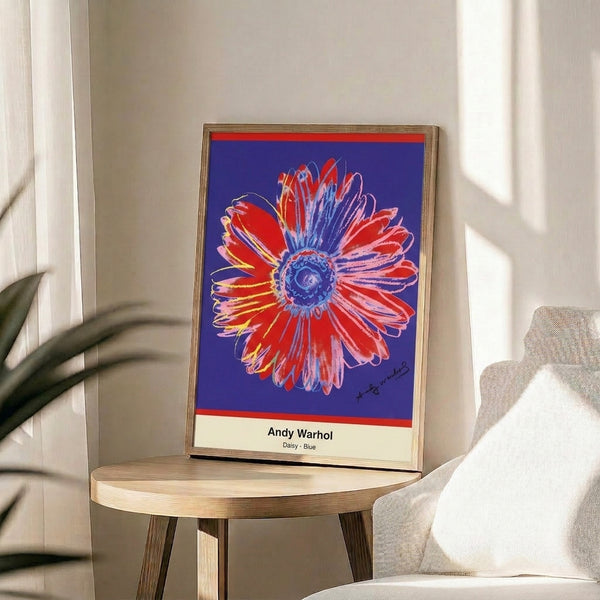 Modern pop art flower print displaying a cheerful daisy in electric blue with sunny yellow center and green accents.