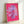 Vibrant pink daisy flower artwork in pop art style with cheerful yellow stamen, bold colorful modern poster suitable for contemporary interiors.
