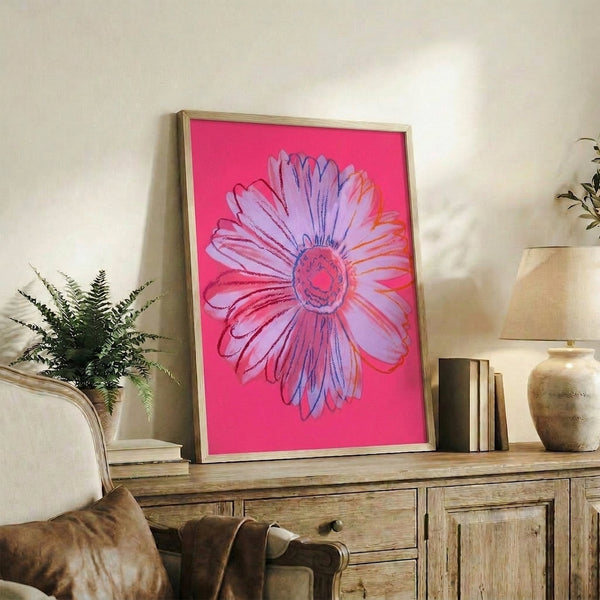Modern pop art floral poster featuring a luminous pink daisy with bright yellow heart, colorful flower wall art in classic graphic style.