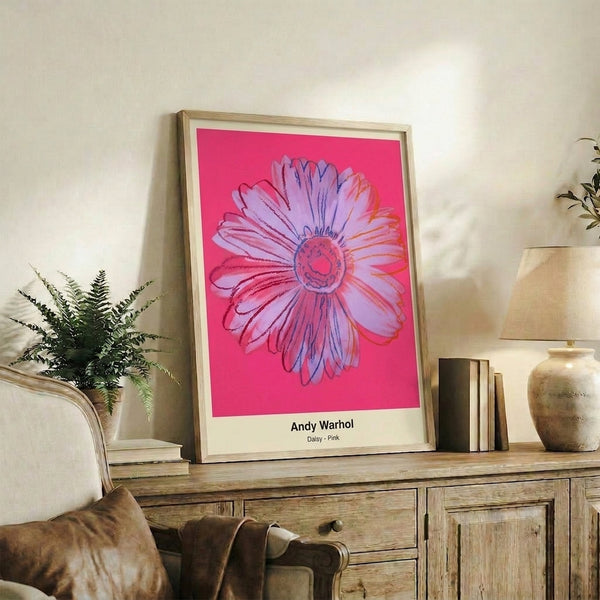Modern pop art poster of a blooming daisy rendered in hot pink and magenta with bold graphic elements and a playful, vibrant aesthetic.