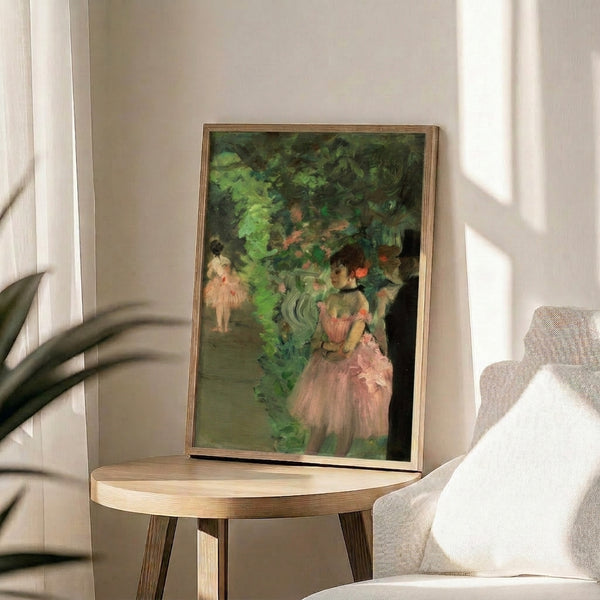 Framed fine art print showing ballet dancers rehearsing or waiting backstage, rendered in muted earth tones with atmospheric Impressionist technique.
