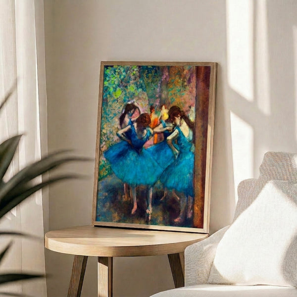 Impressionist framed print of ballerinas in blue tutus and soft blue tones, conveying elegance and quiet movement through pastel artistry.