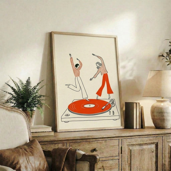 Framed mid-century modern art print showing stylized figures dancing beside a turntable, capturing nostalgic 70s vibes in warm cream and burnt orange with bold black linework.
