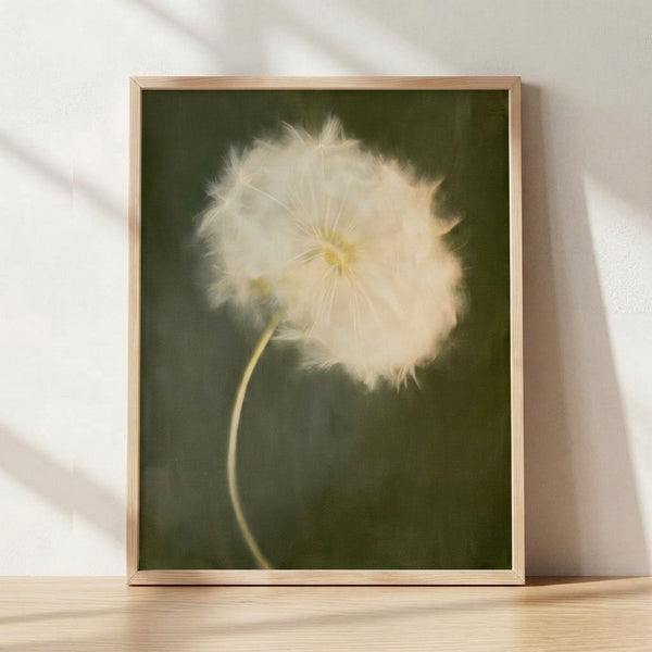 Watercolor dandelion seedhead in soft sage green and cream tones, a minimalist botanical print with peaceful, contemplative mood framed on a wall.