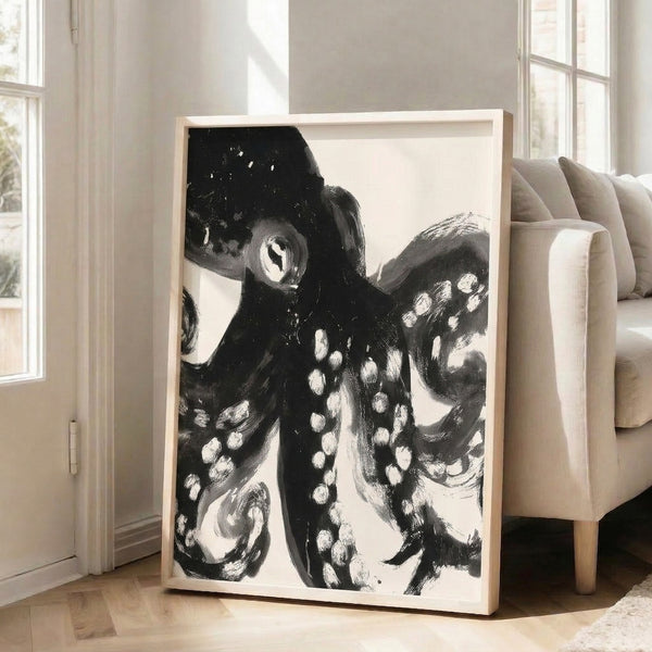 Black and white abstract octopus design with expressive linework, mysterious sea creature study framed on wall.