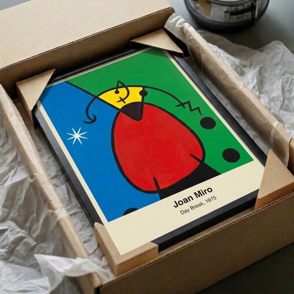 Framed abstract modernist poster featuring Miro's iconic Day Break: whimsical color-field composition with sun and organic shapes in vibrant reds, blues, and yellows.