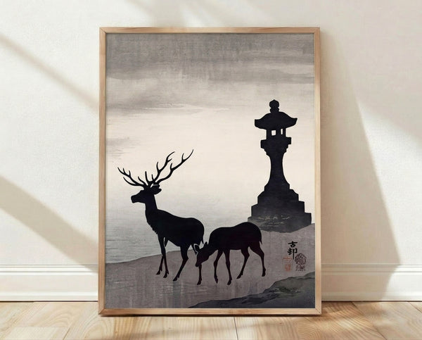 Minimalist Japanese woodblock-style framed poster featuring a serene deer beside a stone lantern with mountain and water elements in black, cream, and charcoal tones.