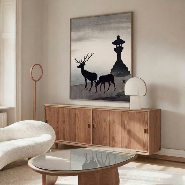 Zen-style wall art depicting a tranquil fawn and stone lantern composition rendered in monochromatic black and cream Japanese artistic tradition.