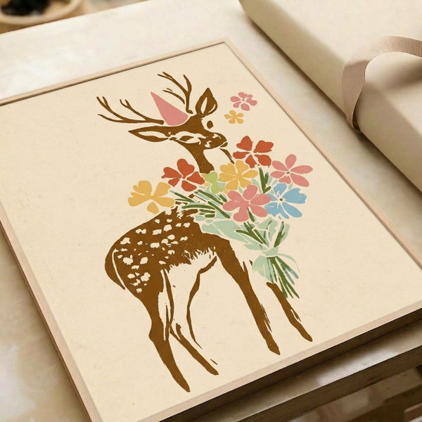 Serene boho watercolor poster showing a whimsical deer crowned with a party hat and holding an elegant flower arrangement in soft sage green, pink, and coral hues, framed on a wall.