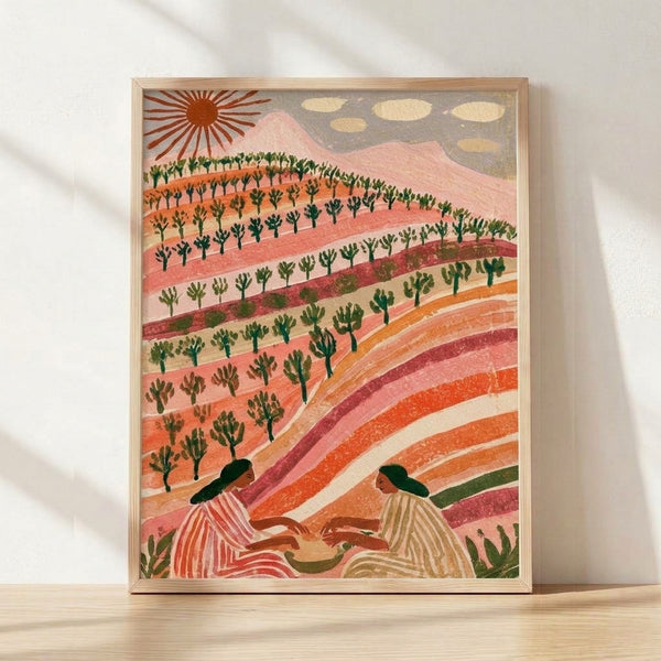 Framed boho landscape poster featuring stylized terraced hills in warm coral and terracotta tones, a peaceful sunrise, and a silhouetted woman figure among cactus and trees in retro japandi style.