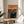 Expressionist art print featuring a troubled figure amid turbulent, expressive linework in a restrained palette of dark and neutral shades, hung on a wall.