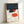 Contemporary kitchen wall art featuring minimalist line drawings of different coffee-making tools and cups in charcoal, cream, coral orange, and soft blue tones.