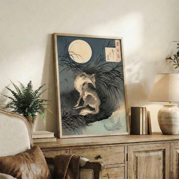 Traditional Japandi wall art showing a contemplative wolf beneath the moon over a landscape of water and grass in restful, muted blue-gray tones.