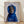 Whimsical pop art portrait of a dogue wearing a stylish blue scarf, rendered in bold blue, black, gray, and white tones on a beige background.