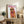 Fashionable dog portrait in sunglasses and neck scarf, contemporary pop art print with a playful, upscale aesthetic in tan and pink hues.