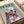 Contemporary pop art poster showcasing a chic poodle with glasses and pink bandana in muted sage, rose, and black color scheme.