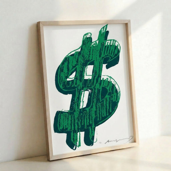 Silkscreen-inspired art print displaying a large dollar sign in striking colors, hanging as framed wall art in pop art style.