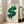 Contemporary wall art print showing a large green and white dollar sign in pop art style, bold black composition with satirical cultural commentary.