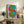 Bold pop art print on wall showcasing a stylized monetary symbol in vibrant, layered colors with a flat graphic treatment.