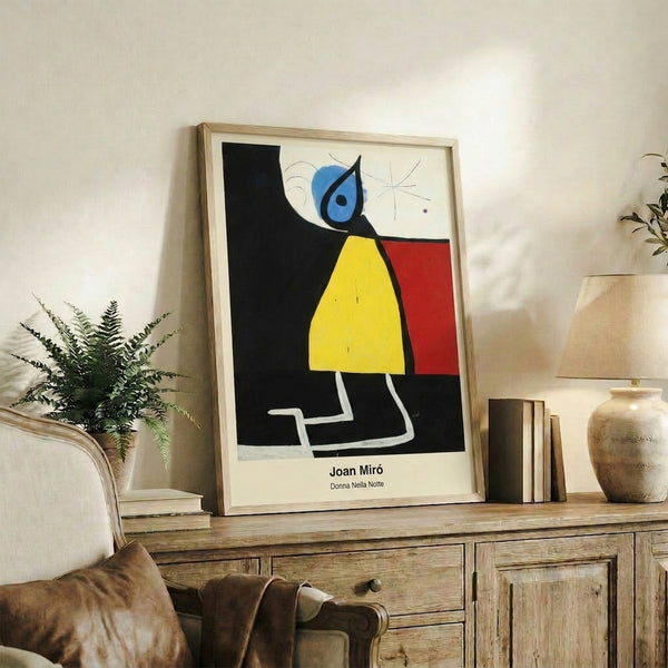 Framed modern abstract poster with mysterious figure emerging from night; dreamlike surreal forms in black, red, and earthy ochre tones.