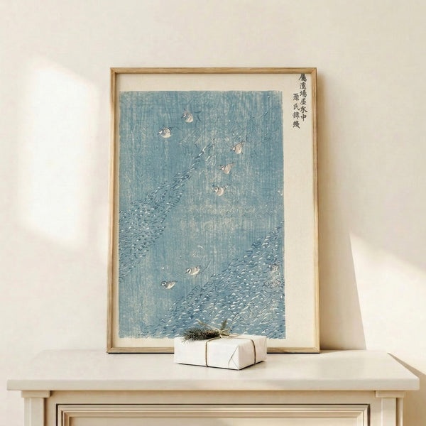 Traditional Japanese woodblock wall art showing birds in water amid rocky landscape, serene composition in pale blue and charcoal gray tones.