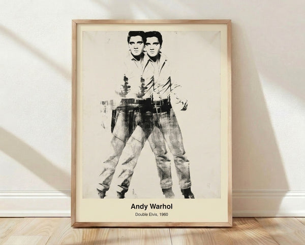 Pop art style double portrait of a man in silhouette repeated twice in silver, black, and white on a framed poster.