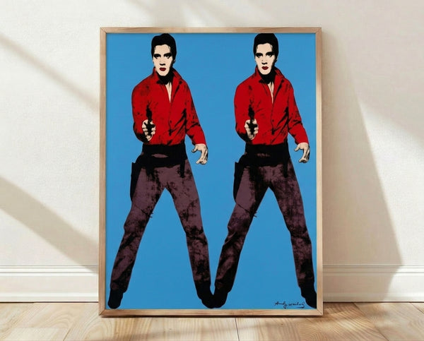 Pop art poster featuring two side-by-side silhouettes of Elvis in a classic Warhol style, rendered in bold contrasting colors with a modern, iconic aesthetic.