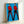 Double Elvis pop art poster with faceless profile silhouettes in striking color contrasts, displayed as a framed modern art print.