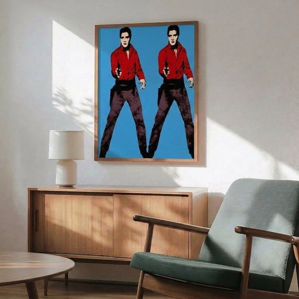 Pop art poster presenting two Elvis silhouettes side by side in brilliant contrasting tones, capturing Warhol's celebrated approach to celebrity imagery.