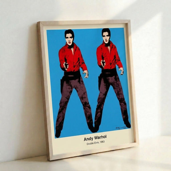 Bold pop art portrait showing mirrored Elvis Presley images in black and silver with yellow accents, exemplifying Andy Warhol's repetition technique and commentary on fame.