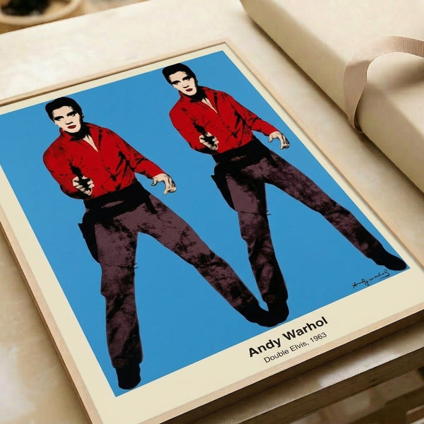 Modern pop art framed poster with repeated figure in bold black, silver, and red—a graphic study of mass-produced imagery and cultural iconography.