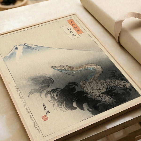 Traditional Japanese print on framed poster form showcasing Mount Fuji embraced by a graceful dragon, combining cream, charcoal, and blue-green with subtle rust orange highlights.