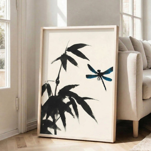 Contemplative botanical art print with a delicate dragonfly resting on bamboo stems, executed in spare black brushwork and soft teal highlights on cream.