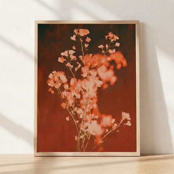 Framed watercolor poster of delicate baby's breath flowers in warm rust and burnt sienna tones on cream background, evoking a romantic boho aesthetic.