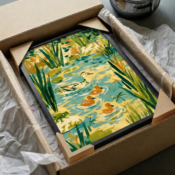 Framed watercolor print of a serene pond landscape with ducks, aquatic plants, and dragonflies in gentle impressionist style, featuring a soothing palette of cream, soft green, and teal blue.