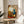 Surreal abstract wall art with floating organic and geometric motifs in muted earth tones, black outlines, and cream background in twentieth-century modernist style.