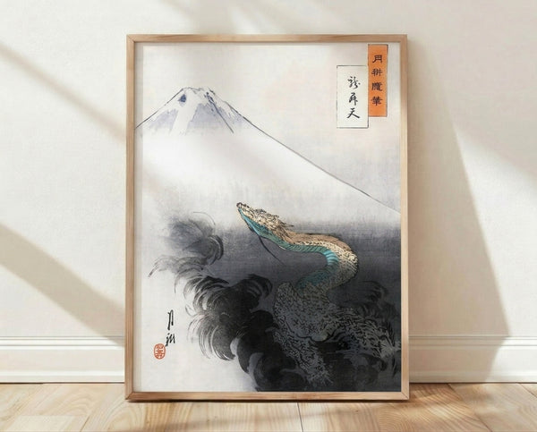 Framed Japanese woodblock art print featuring Mount Fuji with an eagle soaring above rolling waves in cream, blue-green, and charcoal tones, evoking a serene and majestic mood.