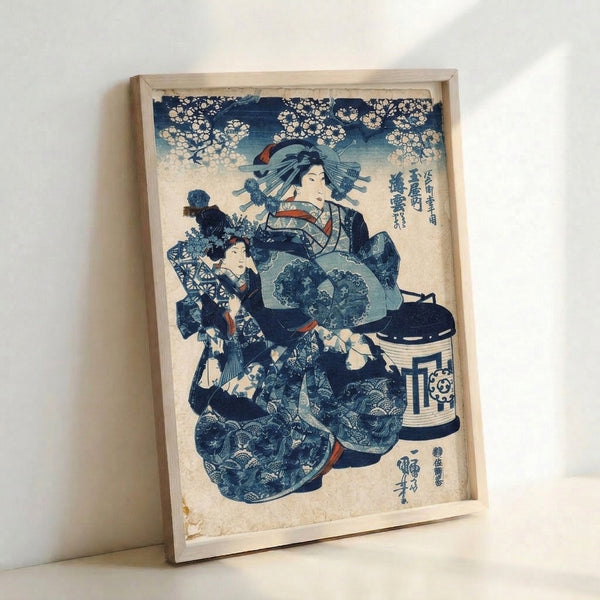 Refined Japanese woodblock art print featuring a geisha in deep indigo robes with coral highlights, a child attendant, and cherry blossom motifs creating an elegant, timeless aesthetic on framed wall art.