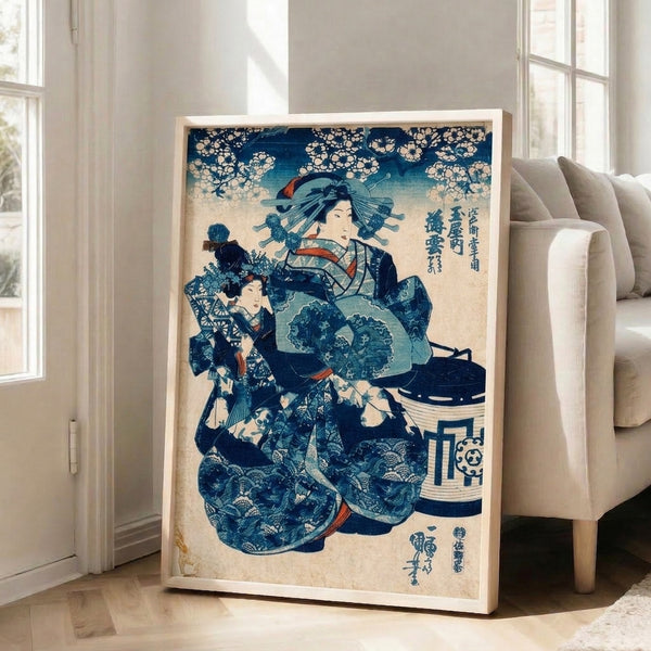 Japanese woodblock print in the ukiyo-e tradition showing a graceful geisha wearing an ornate deep indigo and coral kimono with a young attendant, softly rendered cherry blossoms, and decorative lantern motif.