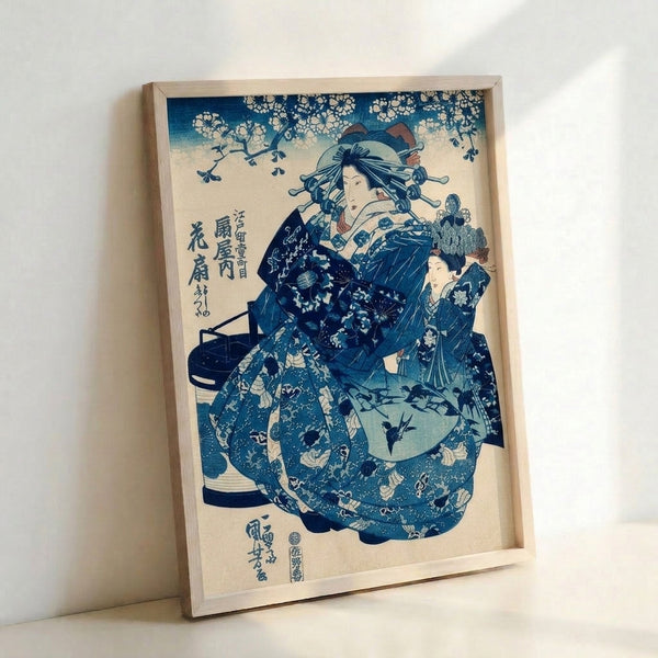 Traditional Japanese woodblock print showcasing a graceful geisha in ornate indigo kimono with fan, featuring botanical elements and birds in a classical aesthetic.