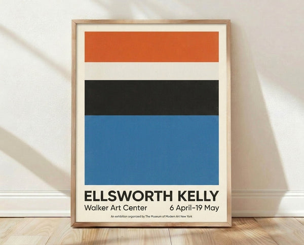Minimalist Bauhaus poster with geometric shapes in orange, cream, and black on a framed wall display.