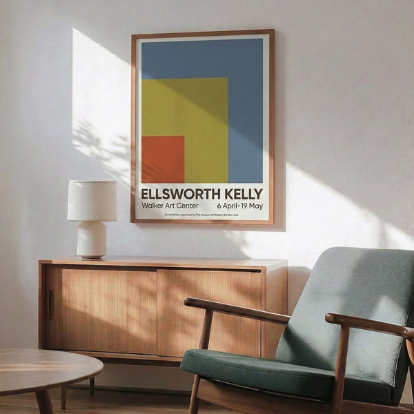 Framed modern abstract print showcasing minimalist color block design in slate blue, rust red, golden yellow, and cream creating geometric visual harmony.