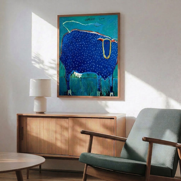 Charming folk art print showing a playful cow and kite motif in minimalist boho style, accented with turquoise, cobalt, red, and yellow hues on a clean white ground.