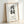 Framed cream and black enso brushstroke print, calm meditative Asian calligraphy art with minimalist japandi design.