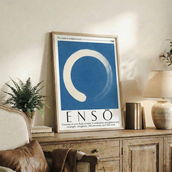 Modern enso circle artwork in brushstroke technique rendered in deep blue on a soft gray background, embodying japandi design and wabi-sabi philosophy.