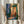 Cultured impressionist wall art of an intimate jazz performance in a quiet urban alley at dusk, with layered watercolor washes of deep blue, warm orange, and muted green tones.